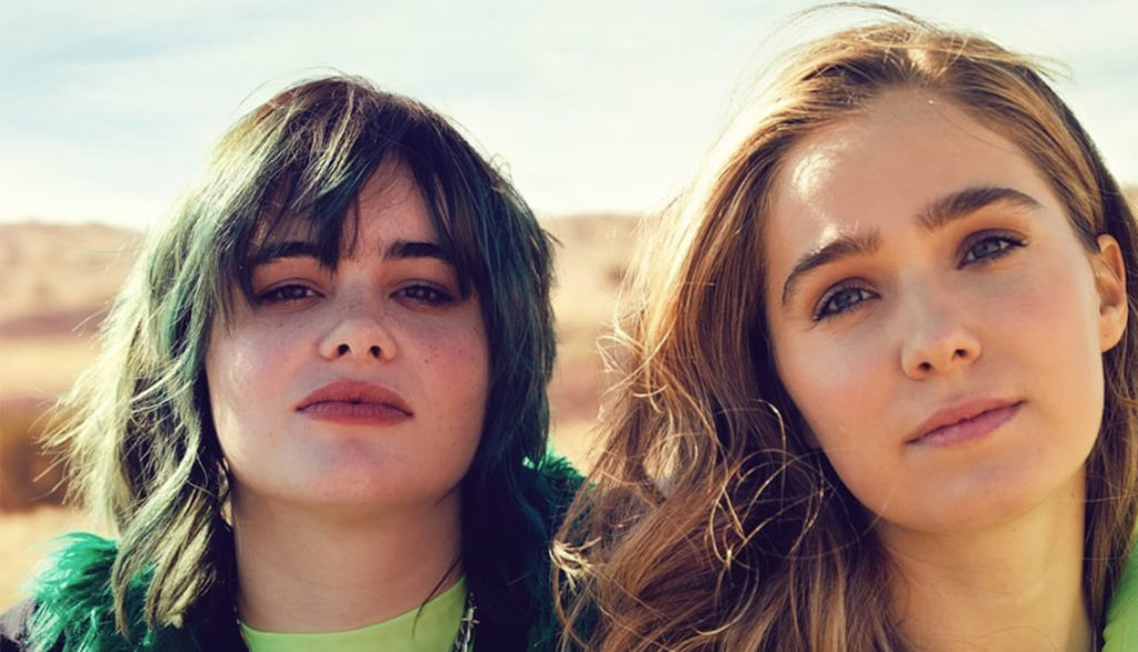 A close-up photograph of two young woman's faces.