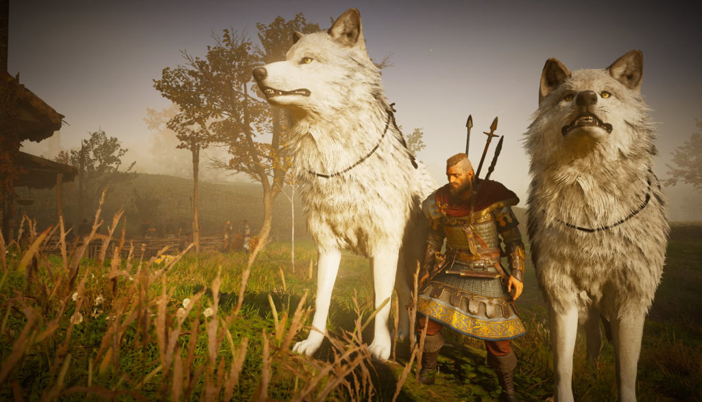 An ominous Viking stands between two enormous wolves.