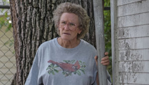 A grandmother, played by Glenn Close, stares with a furrowed brow.