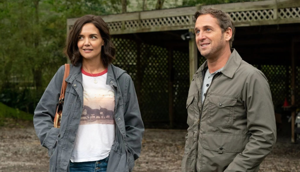 Katie Holmes and Josh Lucas smile at something off camera in the movie The Secret: Dare to Dream.