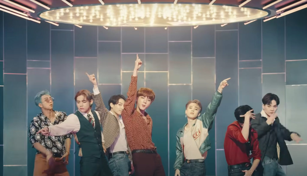 We see the South Korean band BTS dancing in a video for the song "Dynamite."