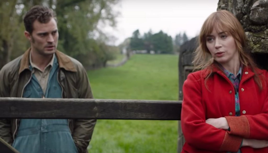 A man and a woman look frustrated, and they're separated by a fence.