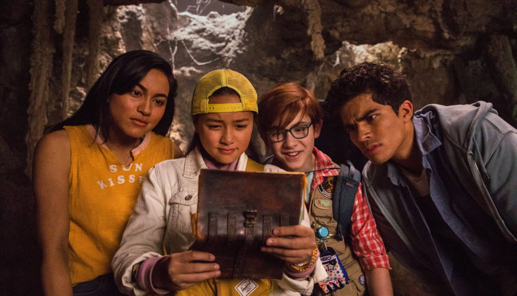 Four kids look at a treasure map.