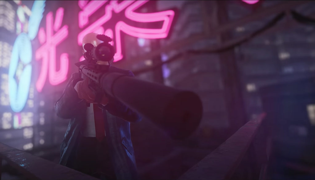 Screenshot of an assassin pointing a gun in the game Hitman 3.