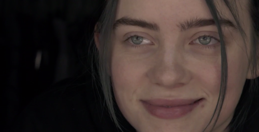 A close-up portrait photo of young rock singer Billie Eilish.