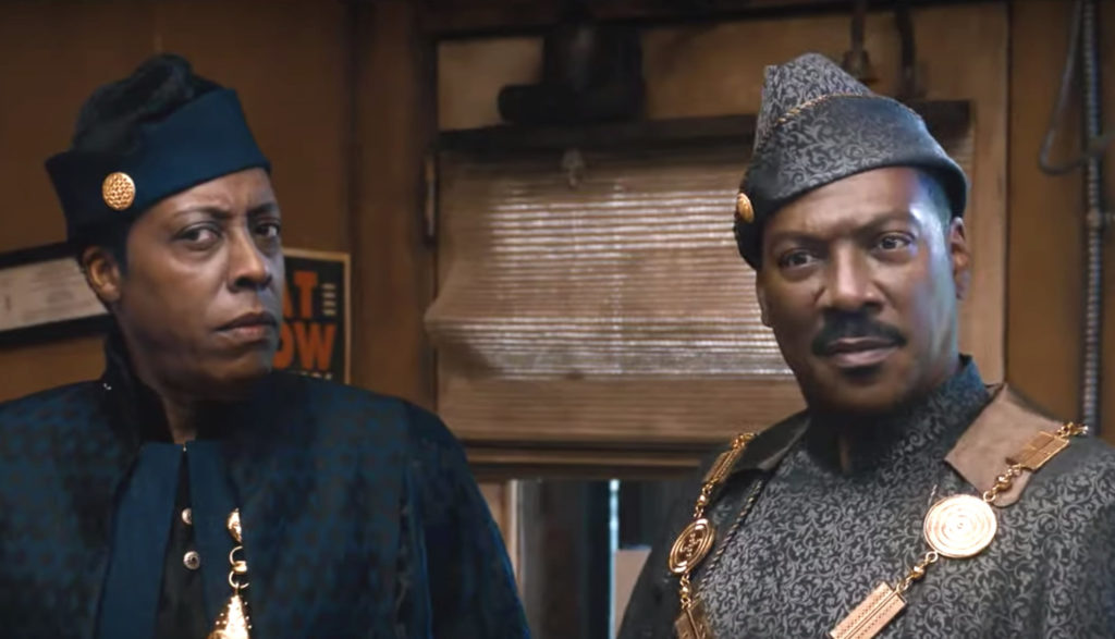 Two royals (one played by Eddie Murphy) dress in traditional cultural garb.