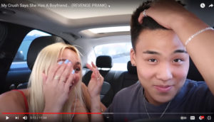 Screen shot of YouTuber Jojo Sim and his girlfriend laughing in a car.
