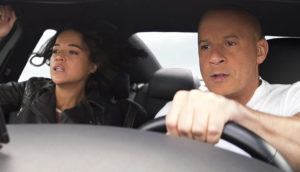 Dom and Letty from the Fast and Furious franchise in a car together.
