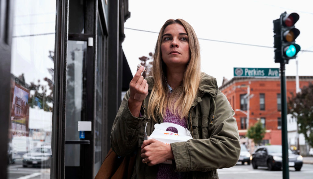 Woman eating donuts