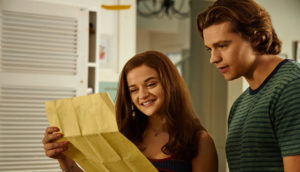 Two teens reading a letter