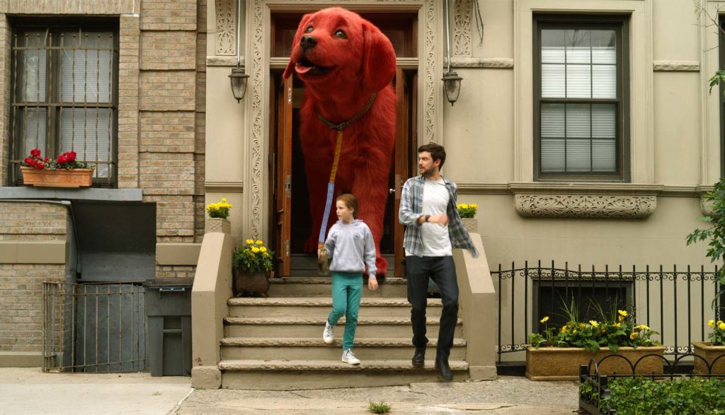 a girl walking her 10 foot dog from Clifford the Big Red Dog movie