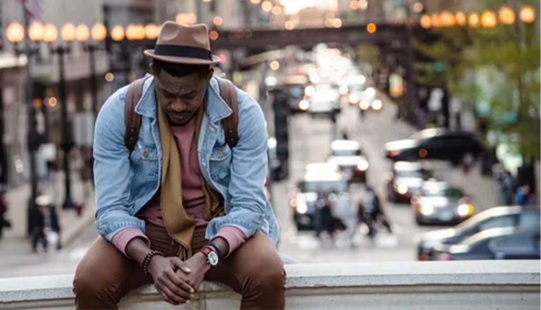 blog top 11-30 man sitting on ledge Photo by whoislimos on Unsplash