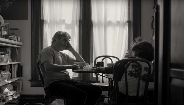 a man and boy sitting at a table in Cmon Cmon movie