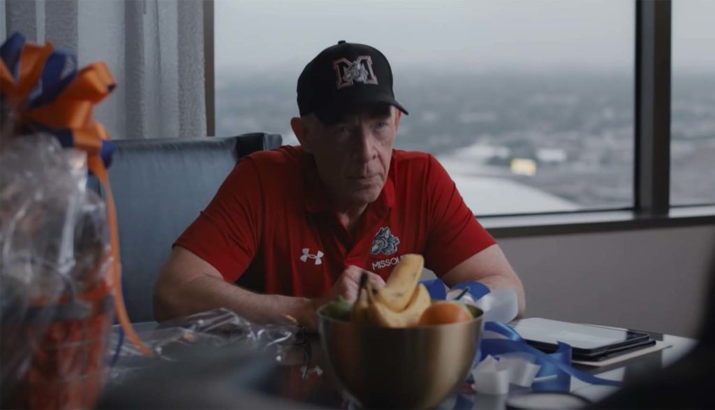 a coach talking to a lawyer in National Champions movie