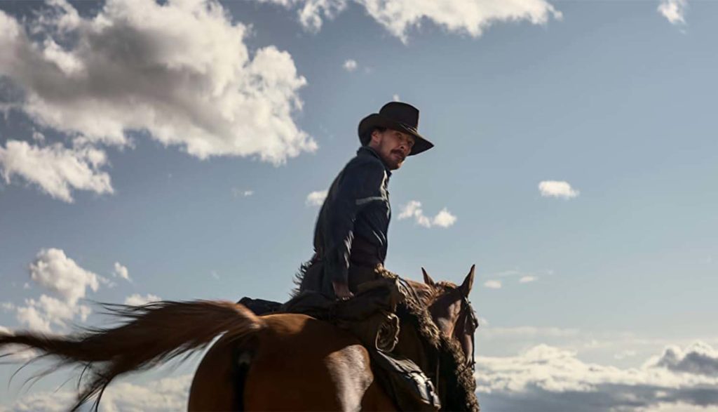 man riding a horse in The Power of the Dog movie