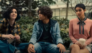 Three genetically modified superheroes sit on a bench.