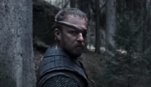 A one-eyed man stares ominously.