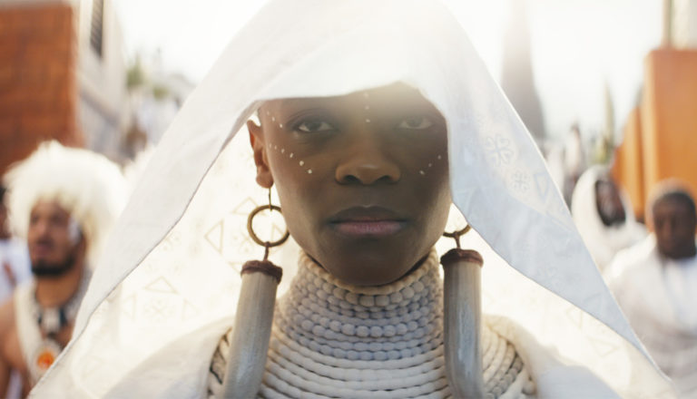Woman in white funeral garb - Black Panther: Wakanda Forever