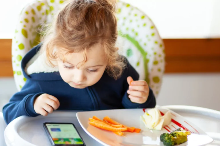 Young child sitting in a high chair