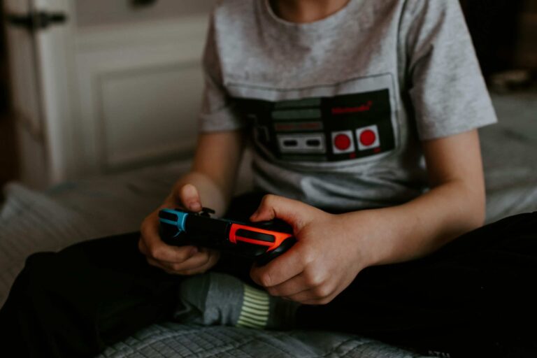 boy hands holding game controller